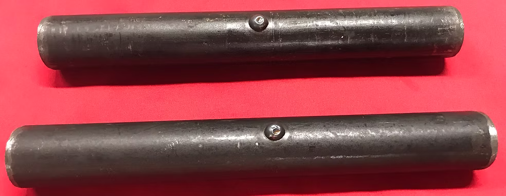 "Close-up of a durable fence equipment latch designed for livestock fencing, ensuring secure connections for cattle pens and continuous fence panels, featuring a tough bar fence design for enhanced durability."